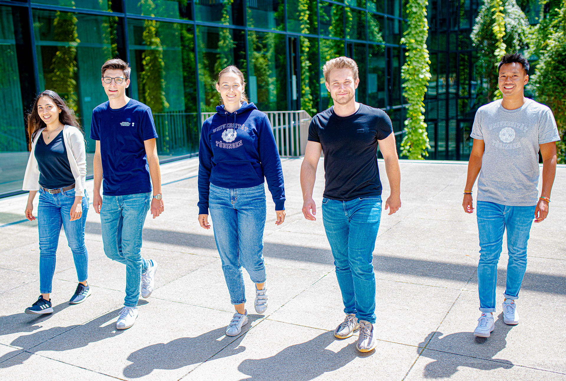 5 Students walking on the campus