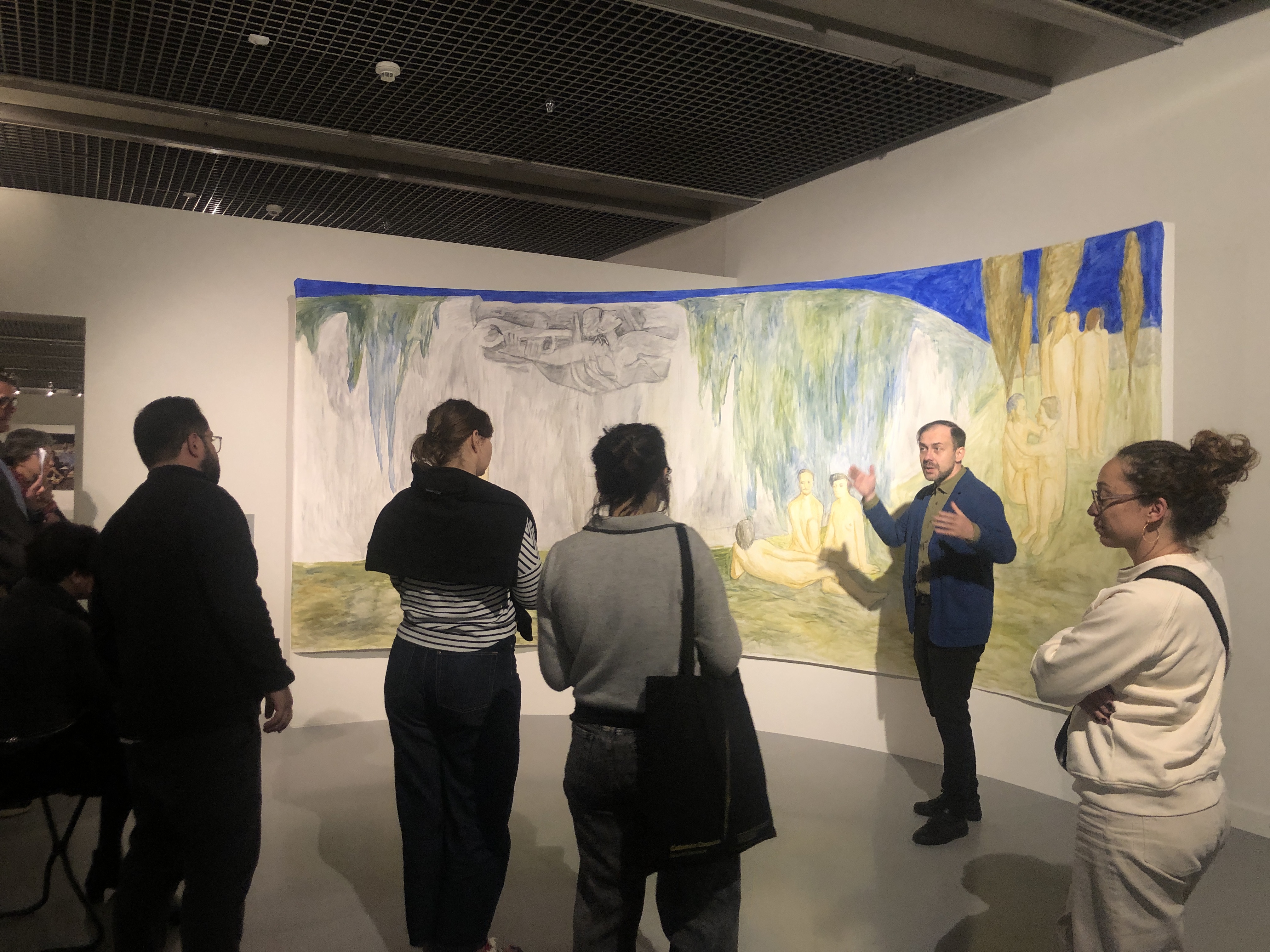Dr Daniel Muzyczuk introduces the group to the new reinstallation of the permanent collection at the Muzeum Sztuki in Łódź