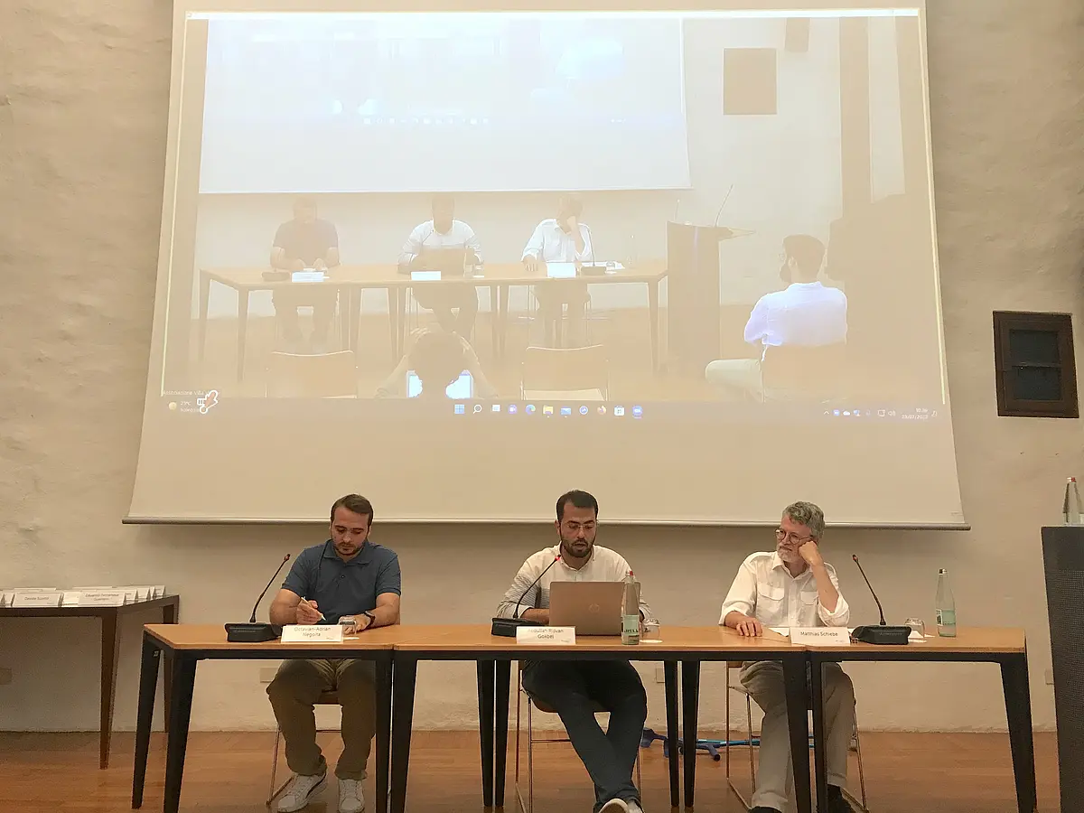 Speakers at a conference