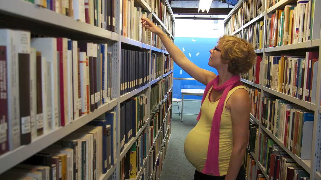 Tile icon showing a pregnant woman in front of a library shelf (linked to "Studying with a child")