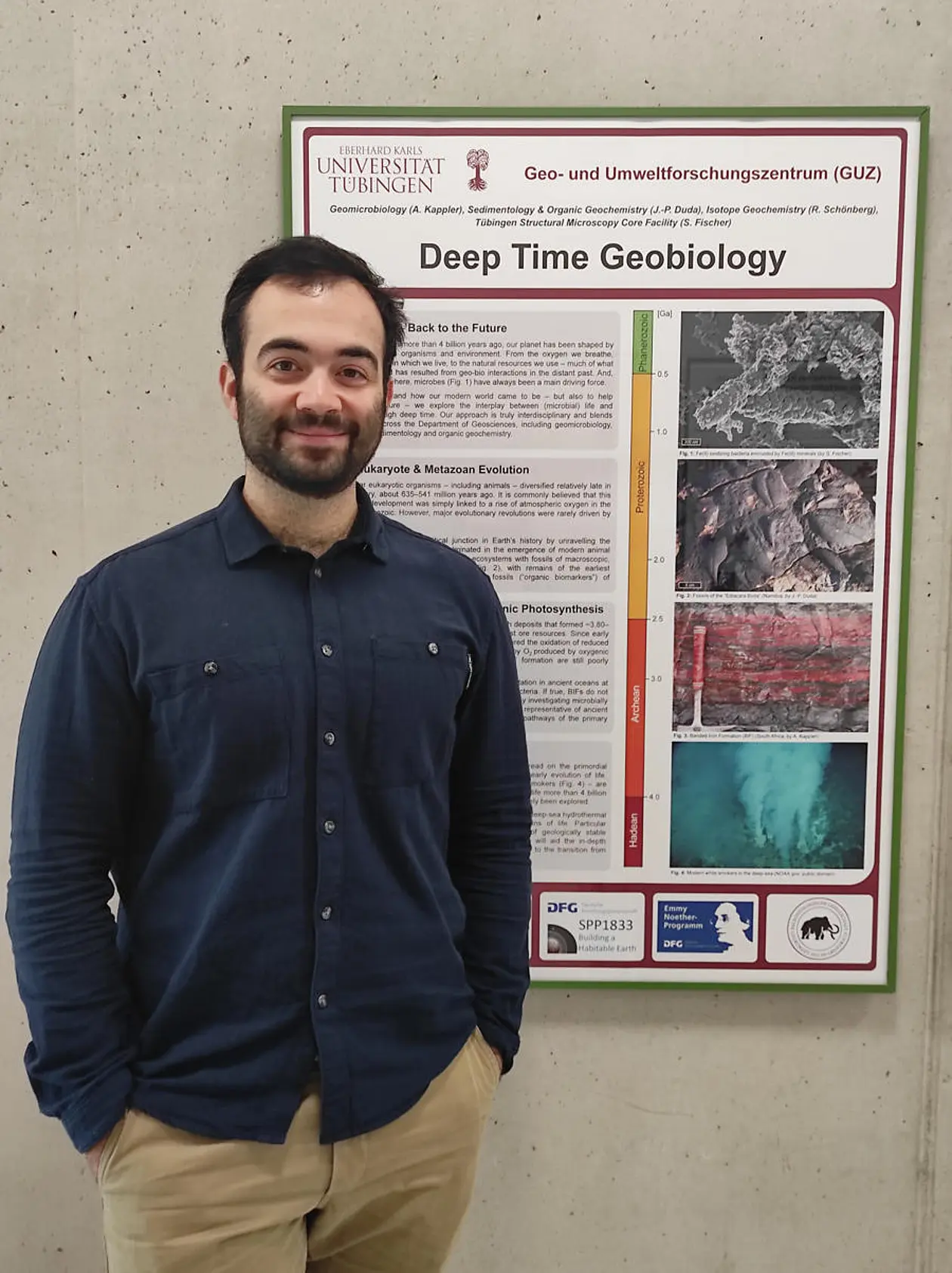 Eric Runge with poster presenting his field of work