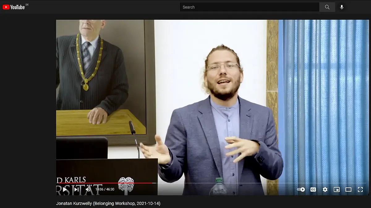 A speaker standing at a lectern
