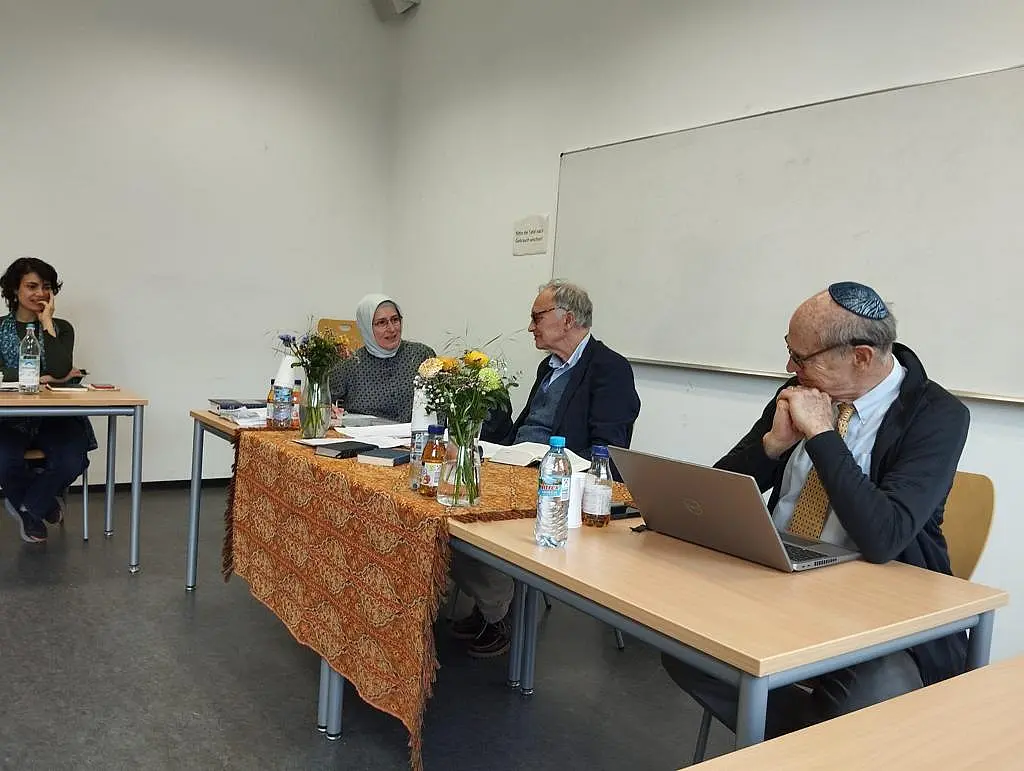 3 scholars in conversation