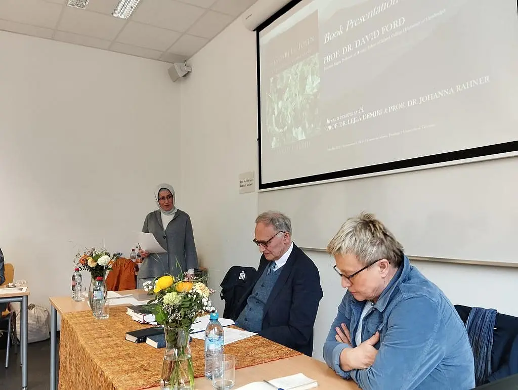 3 scholars in conversation
