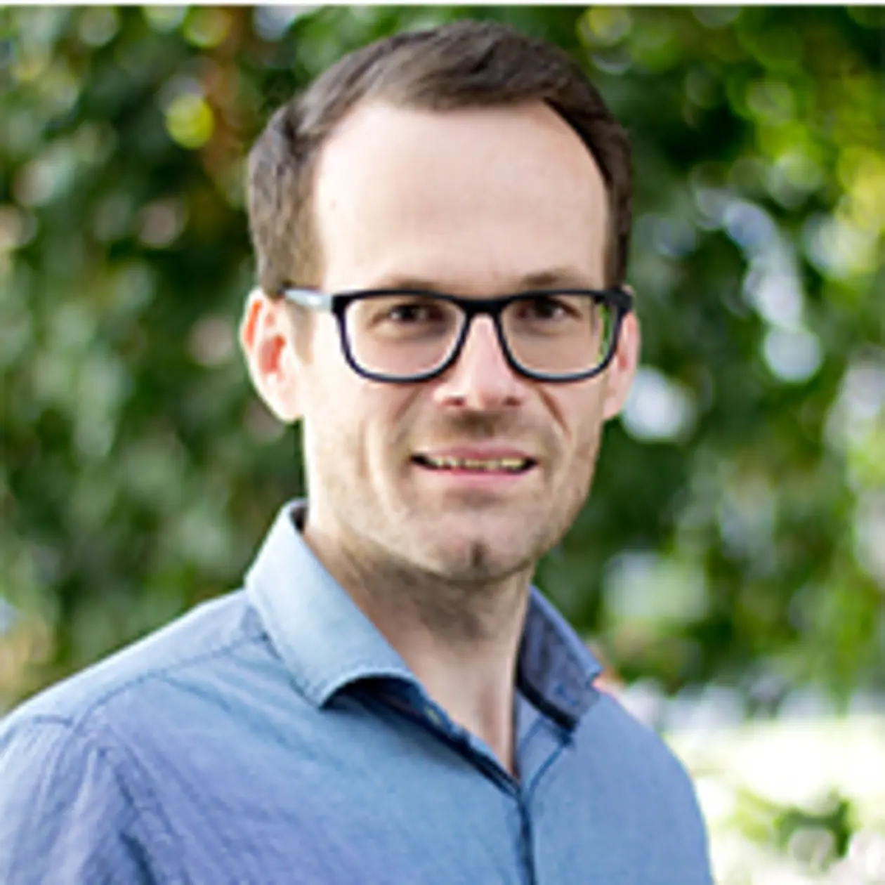 Steffen Hage smiles into the camera