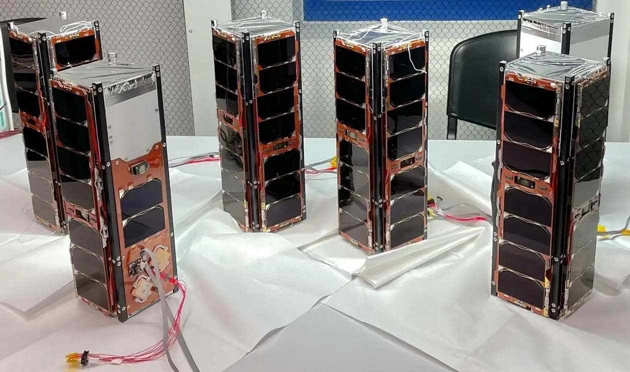 Six rectangular towers of solar panels with cables