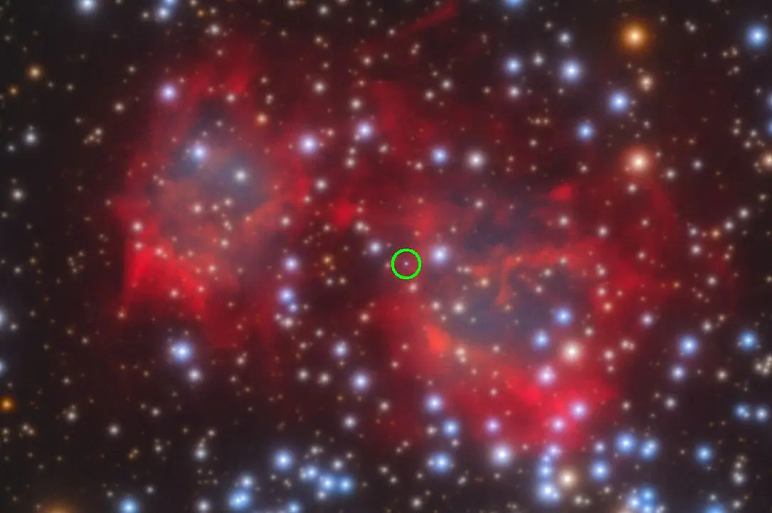 Brightly shining dots in front of red fog, one dot is circled in green