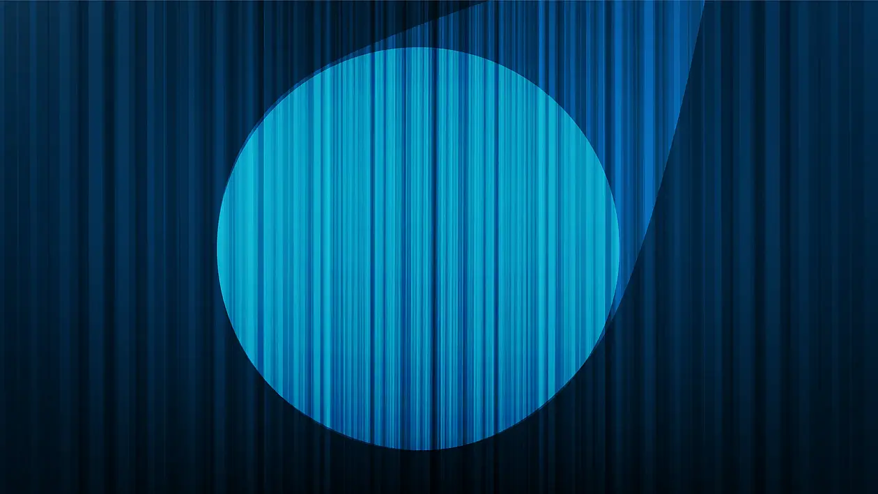 Spotlight on a blue stage curtain