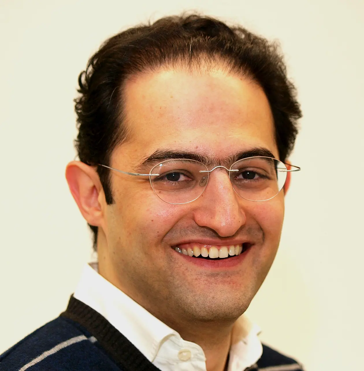 Alireza Gharabaghi smiles into the camera