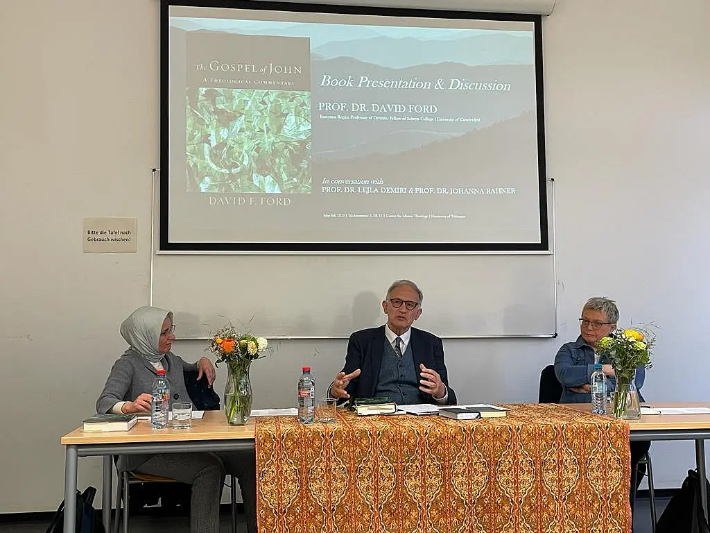 3 scholars at a book presentation