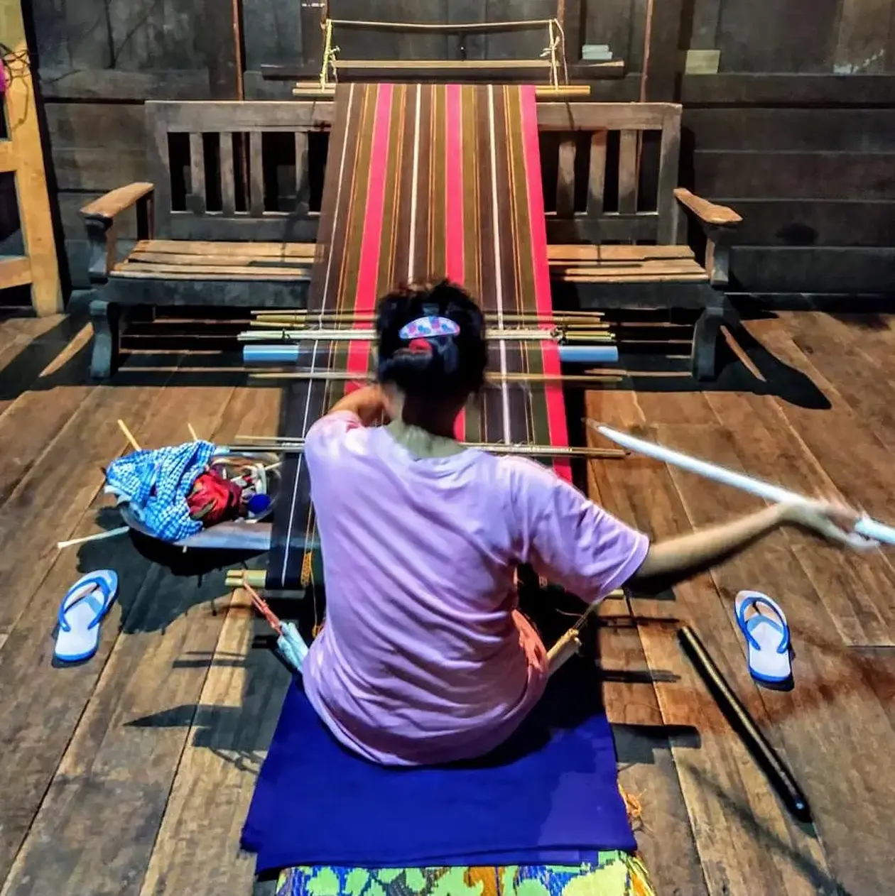 Sewing woman sitting on the floor