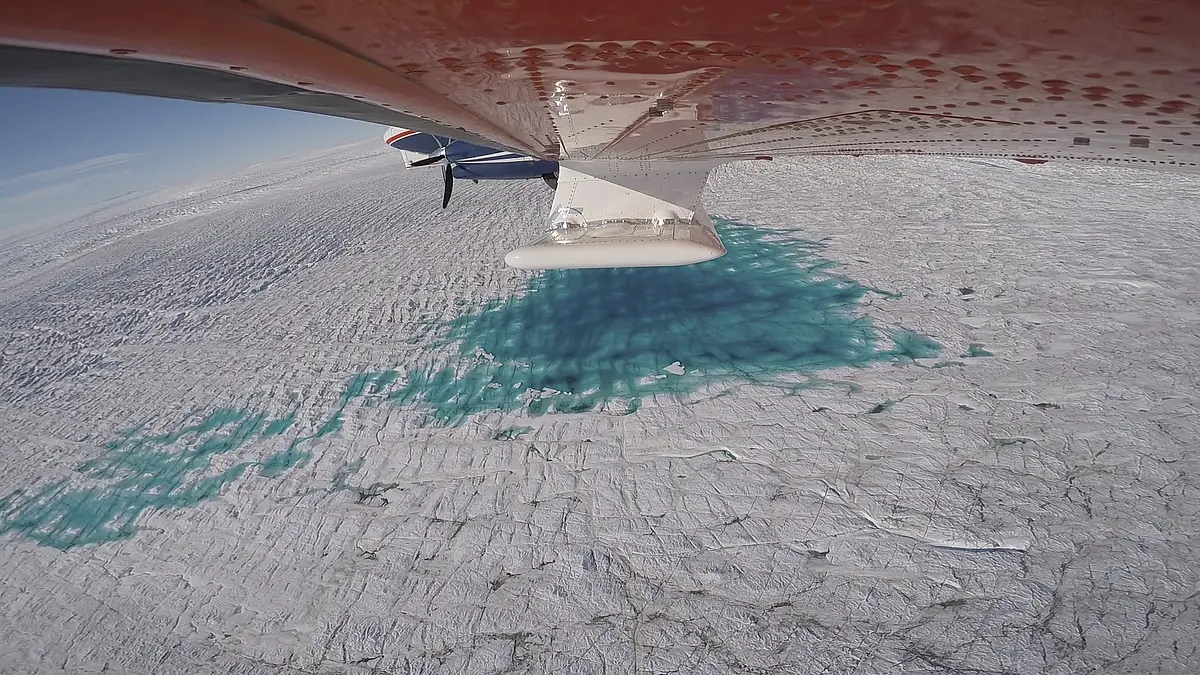 The research aircraft Polar 6 of the Alfred Wegener Institute is flying over the 79-degree-north glacier in Greenland