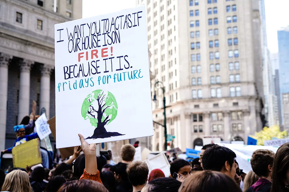 Poster at climate manifestation saying "I want you to act as if our house is on fire! Because it is. fridays for future"