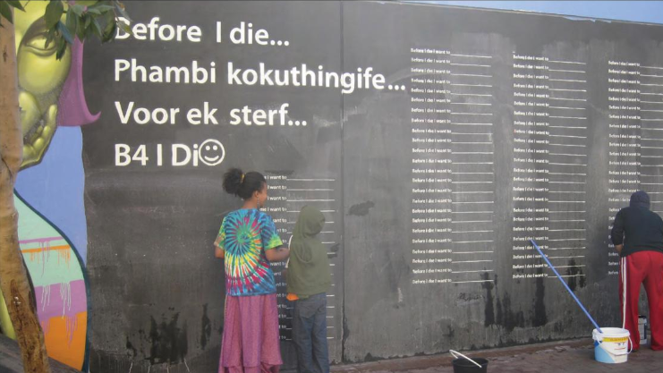 the book cover: a wall of differnt frases beginning with "before I die"