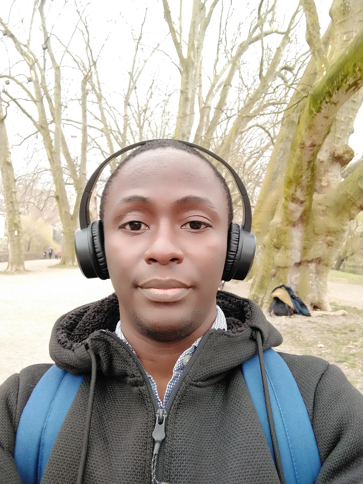 young man with headphones looking into the camera