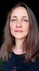 A woman in her mid 30s with dark blonde shoulder length hair