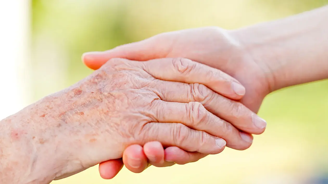 Tile image showing a young and an old hand holding each other (linked to "Caring for relatives")
