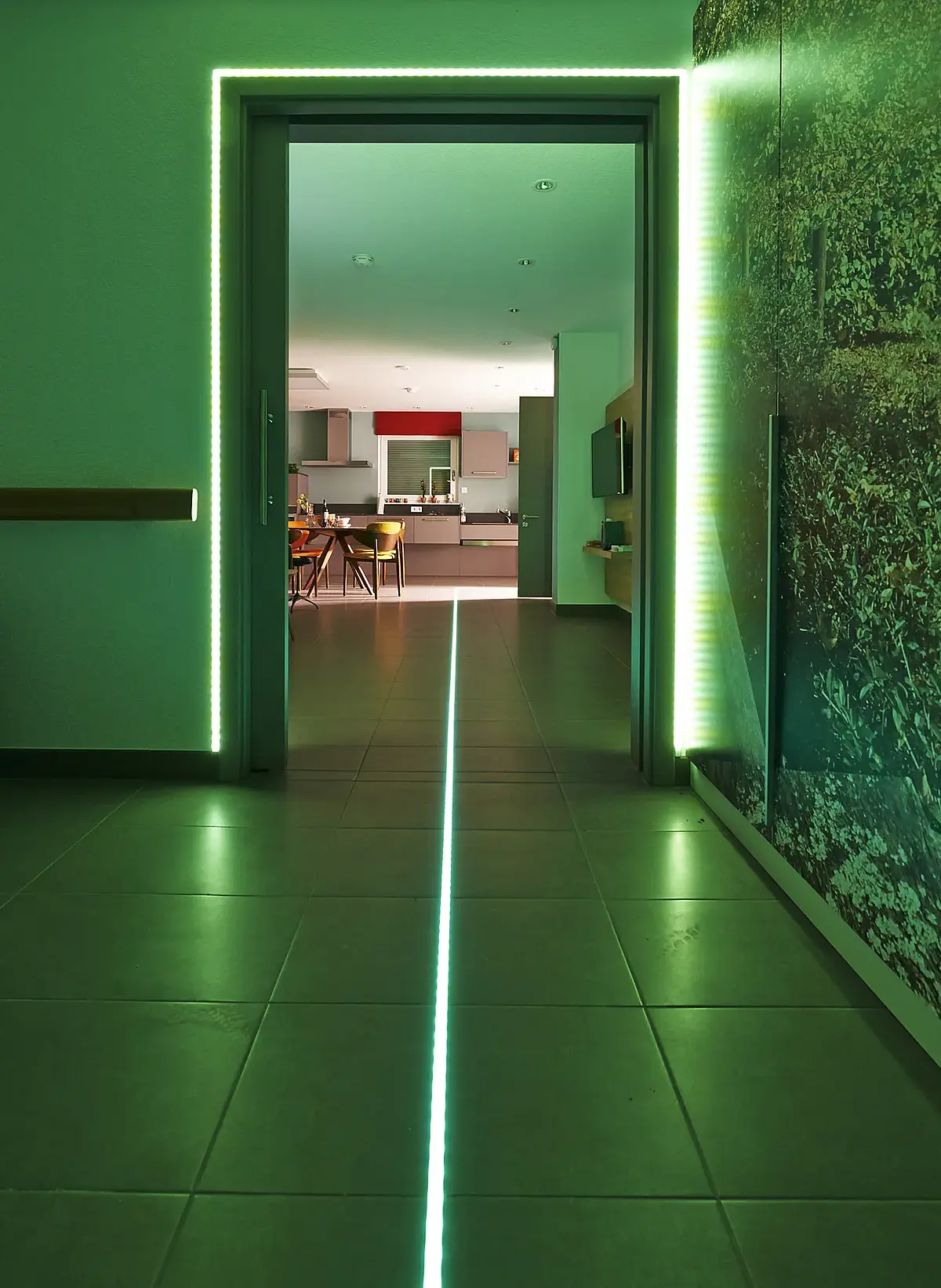 A green light strip on the floor.