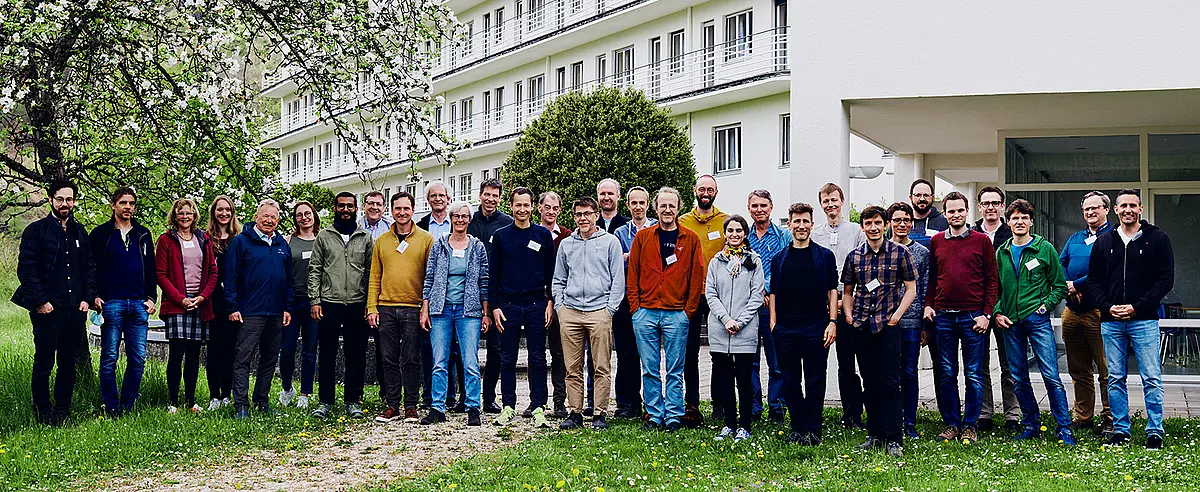 Group photo of about half of all cluster members in front of a building in Bad Urach.