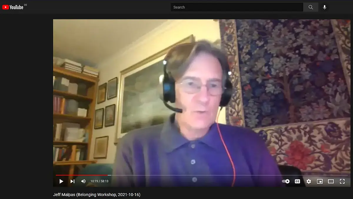 A sitting man around 60 with headset