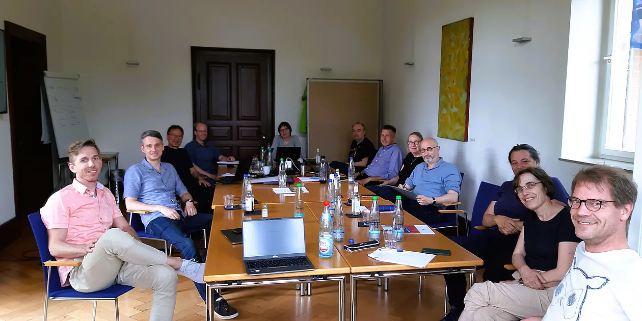 Participants of the retreat, sitting around a table