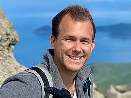 Portrait shot of Dr. Markus Maisch smiling into the camera.