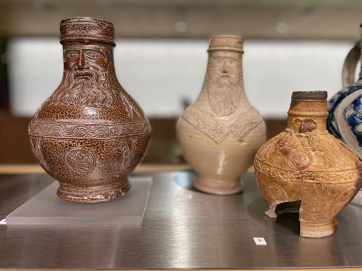 A picture of three Bartmann jugs.