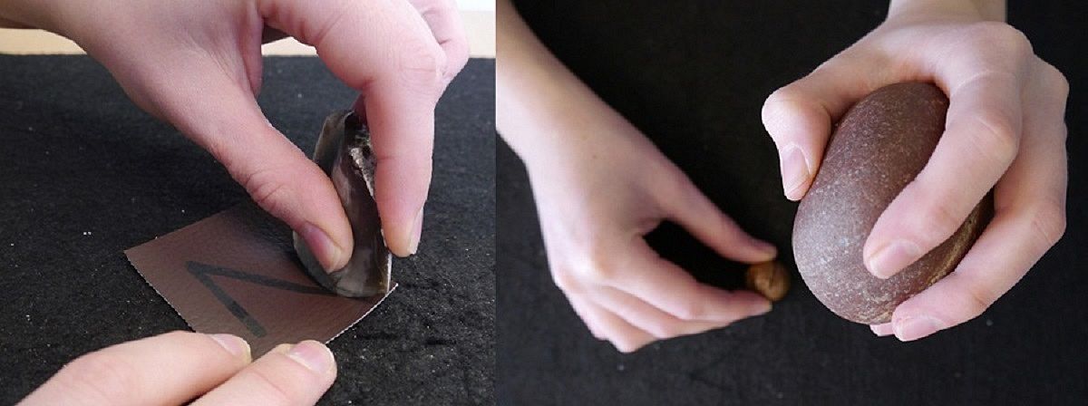 A researcher demonstrates which tasks the participants were asked to perform during the experiment - here in the planning phase: on the left, making precise cuts in leather; on the right, cracking nuts using stone tools. 