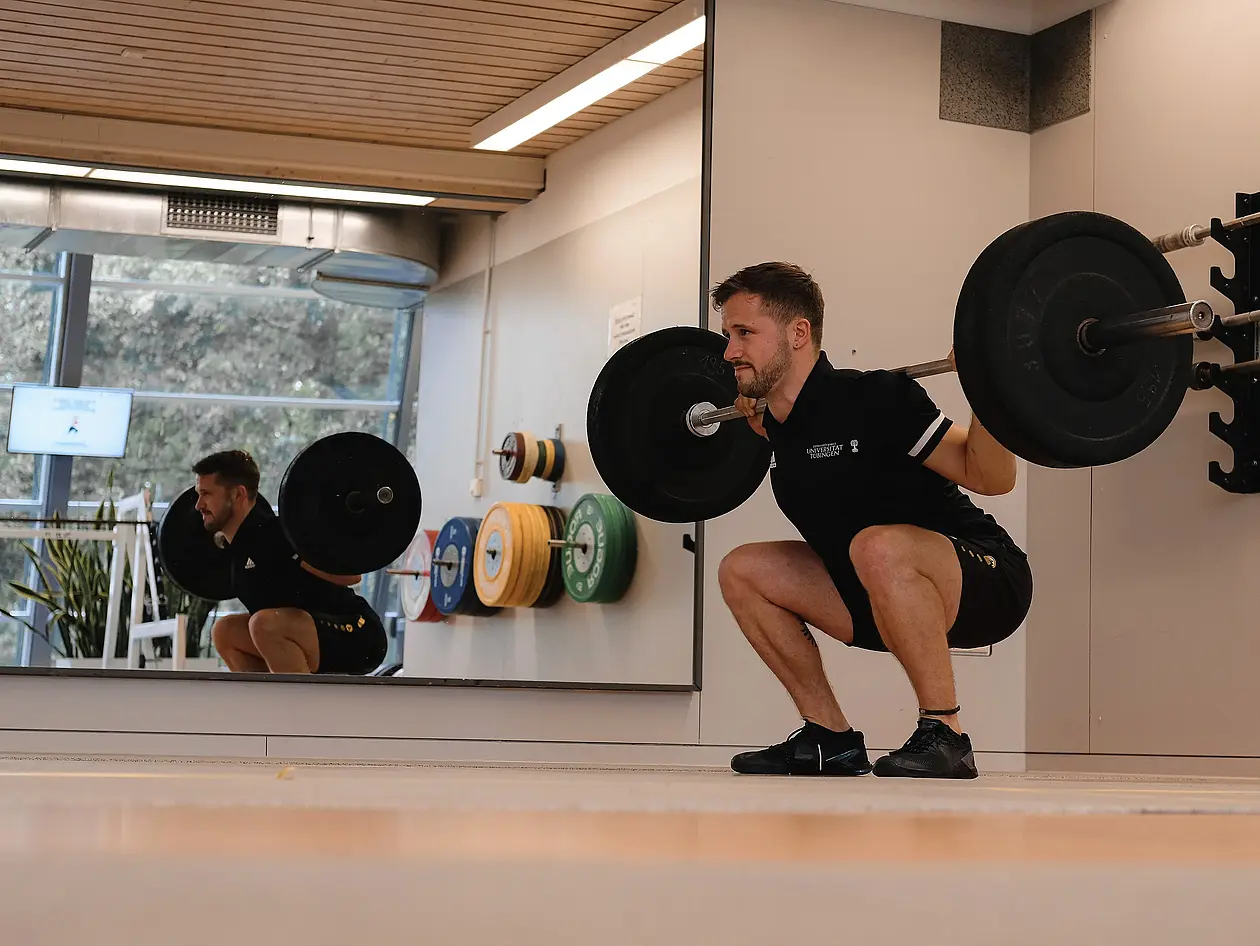 A student doing fitness training in the Health and Performace Lab