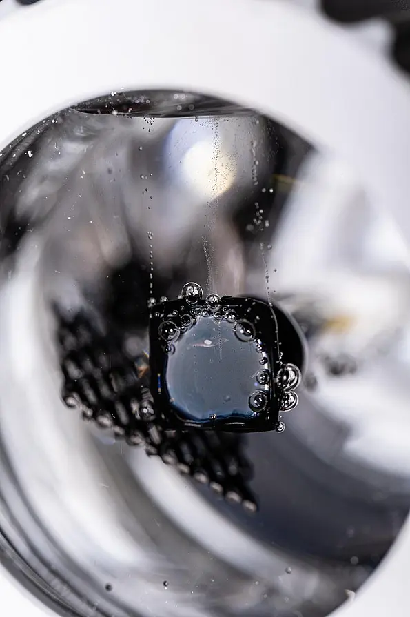 Close-up of the photoelectrochemical solar cell in the round solar simulator.