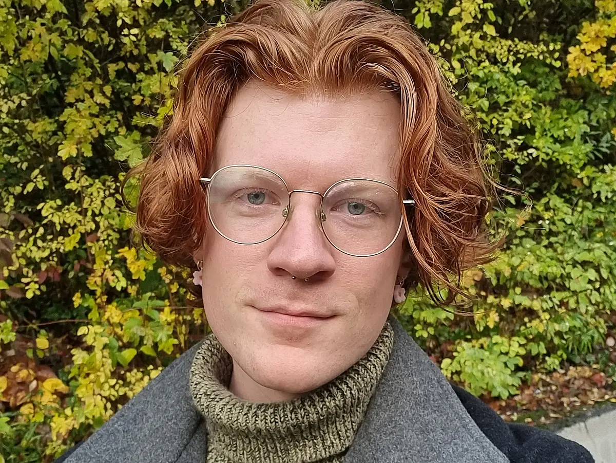 Head shot of Tyler Houston smiling into the camera.
