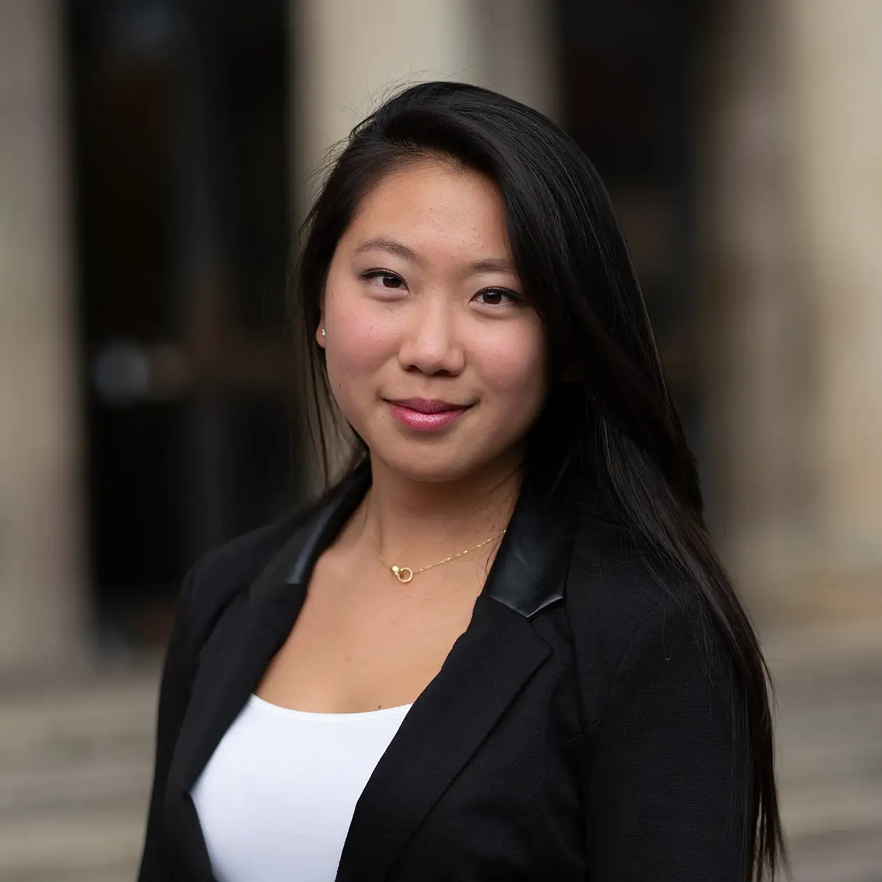 Picture of Jiazhen Li standing in front of the University